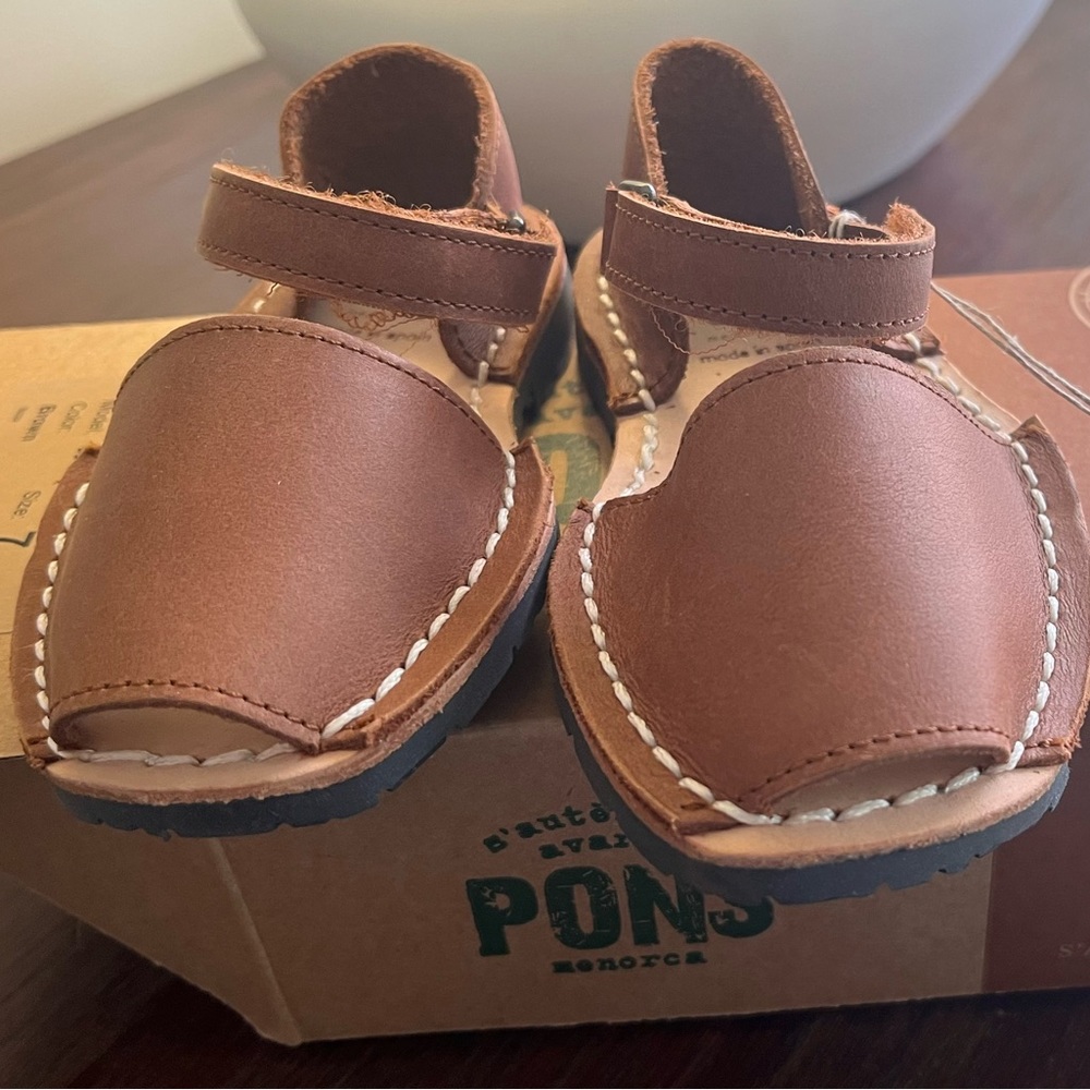 New, never worn, in box, with tags. Pons sandals. Kids size 7